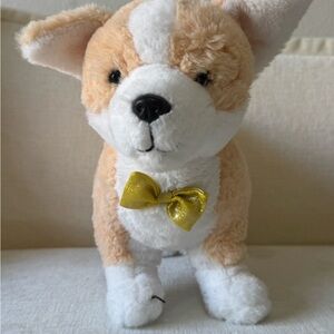 FAO Schwarz Tan and White Plush Dog Toy with Gold Bow